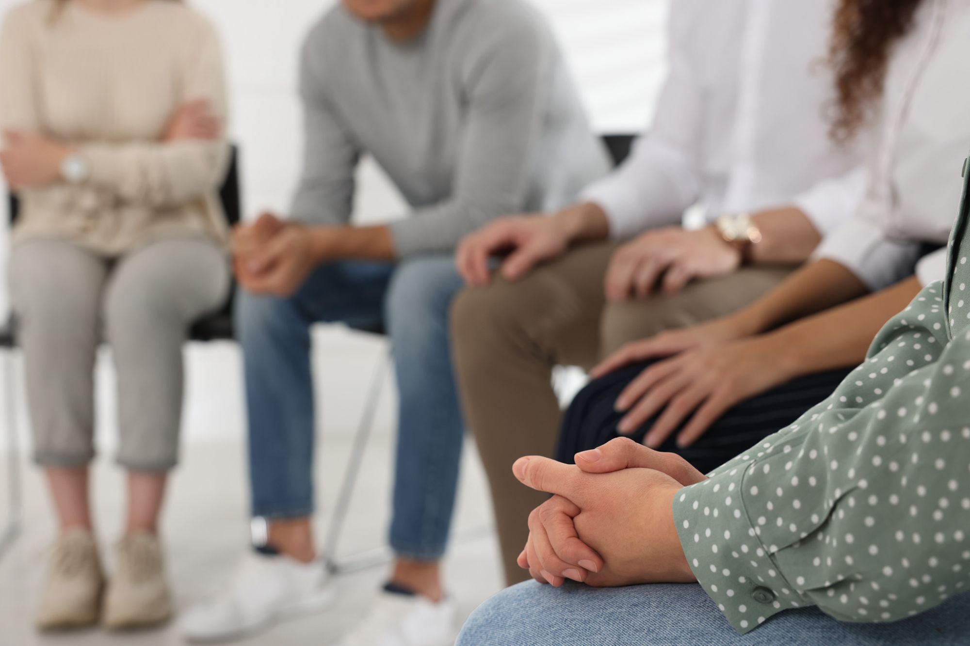 People sitting in a circle at a meeting